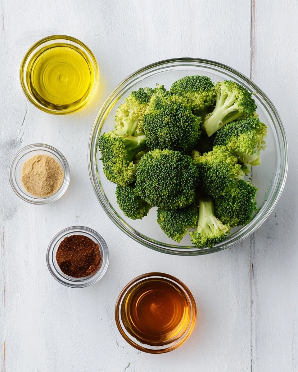 A clear glass bowl filled with bright green broccoli florets sits in the center of a white marbled surface. Surrounding the bowl are four small clear glass containers: one with golden yellow oil on the left, another with light brown powdered spice at the bottom left, a third holding dark brown ground spice at the bottom right, and a fourth with amber honey on the right. The arrangement is neat and organized with the broccoli bowl as the main focus, and all items set on a clean white marbled background photo taken with an iphone --ar 4:5 --v 7