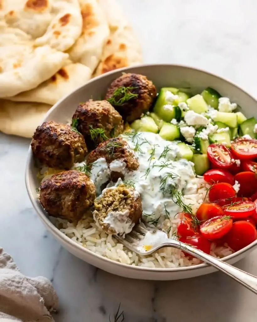 Gyro Bowls with Meatballs, Tzatziki, Lemon Rice, and Cucumber Salad Recipe
