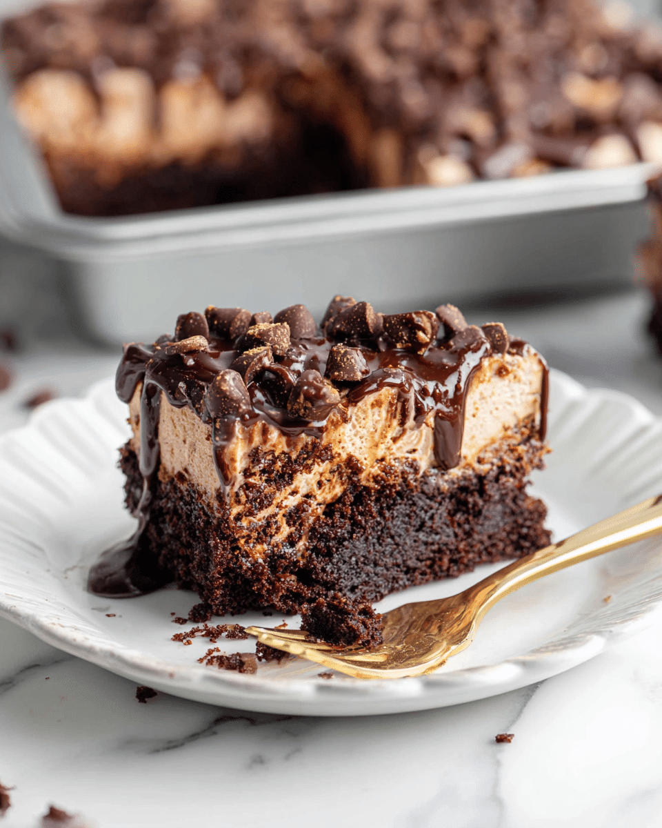A slice of chocolate cake with two layers is placed on a white scalloped plate on a white marbled surface. The bottom layer is dark brown and dense with a moist texture. The top layer is light brown and creamy, covered with many small chocolate chips and drizzled with thick chocolate sauce. A gold fork lies next to the cake slice with some cake crumbs around it. In the background, there is a metal baking pan filled with more cake pieces. Photo taken with an iphone --ar 4:5 --v 7
