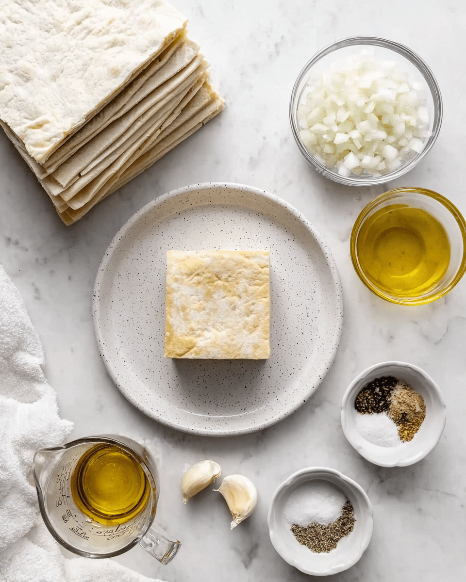 A white speckled plate holds a square piece of light beige dough in the center. Above it, layers of similar dough sheets are stacked evenly, with a clear glass bowl filled with finely chopped white onions on the top right. To the right of the plate, a small white glass bowl contains a golden-yellow liquid, likely oil. On the bottom right, there are two more small white bowls—one with a white powder and the other with a mix of black, brown, and white spices. A small white bowl near the center contains two garlic cloves. On the bottom left, a clear glass measuring cup is filled with more golden-yellow oil, sitting on a white marbled surface with a nearby white cloth. Photo taken with an iphone --ar 4:5 --v 7