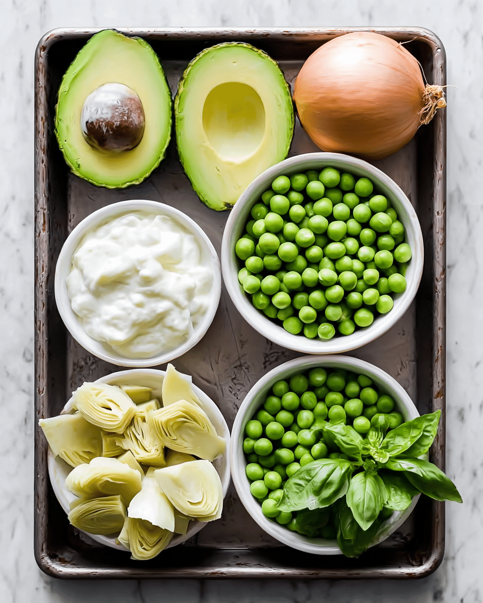 The image shows a dark tray with six food items arranged neatly. On the top left corner, there are two avocado halves, one with a brown seed and the other empty, both showing a bright green inside. To the right of the avocados, a whole brown onion rests at the top edge. Below the avocado halves, there is a white bowl full of white creamy substance with a smooth texture. Next to it, on the right side, a white bowl contains many round, green peas. Another white bowl with round green peas sits at the bottom right, with a small bunch of fresh green basil leaves resting on top. The last white bowl, at the bottom left corner, holds pale yellow artichoke pieces cut into segments. The tray is placed on a white marbled surface. photo taken with an iphone --ar 4:5 --v 7