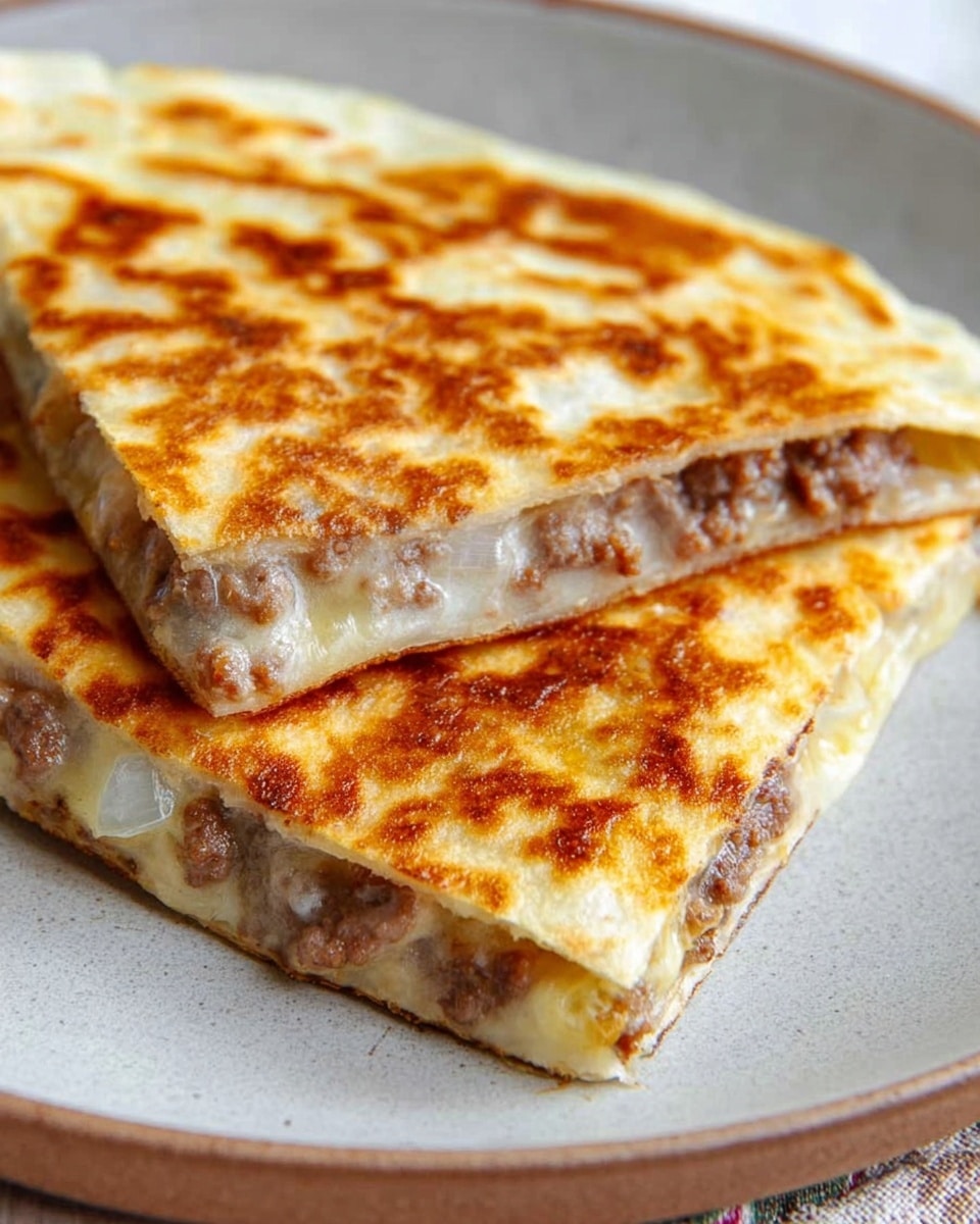 A close-up view of two square pieces of quesadilla with a golden-brown grilled top layer that looks crispy and slightly bubbly, showing a thin, light-colored tortilla. Inside, the layers are filled with browned ground meat and small chunks of cooked onion, creating a mix of light brown and white colors. The quesadilla pieces are stacked slightly off-center on a simple white plate, with a white marbled surface underneath. Photo taken with an iphone --ar 4:5 --v 7