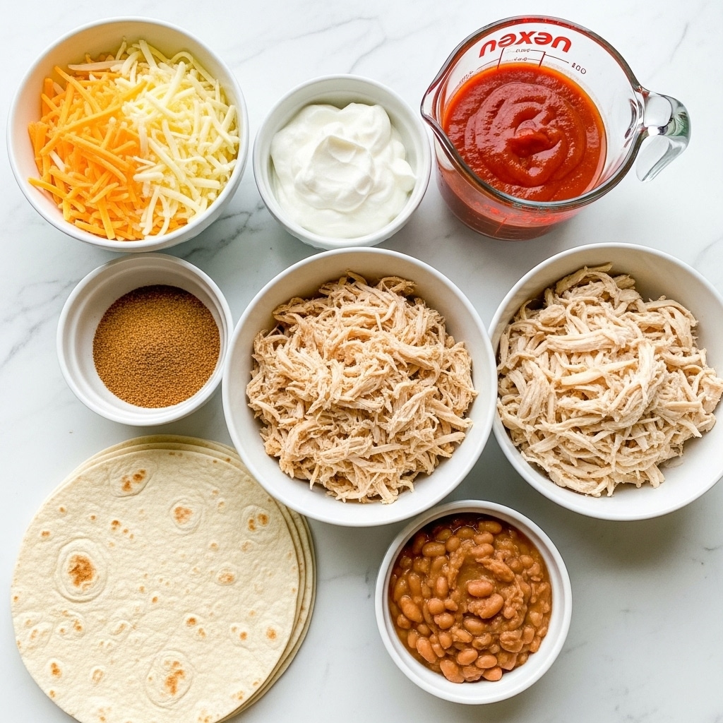 The image shows six bowls and a stack of tortillas arranged on a white marbled surface. Starting from the top left, there is a bowl filled with a mix of shredded yellow and white cheese. Next to it, on the right, is a glass measuring cup with smooth red enchilada sauce. Below the sauce, a white bowl contains shredded chicken with a light tan color and stringy texture. To the left of the chicken, there is a small bowl filled with taco seasoning, which looks like a fine, brown powder. Above the seasoning, another bowl holds creamy white Greek yogurt with a thick texture. At the bottom right, a small white bowl contains refried beans with a smooth, slightly chunky light brown surface. At the bottom left, three round, white tortillas are stacked, showing soft texture and light brown spots. The bowls are arranged close together, with clear labels on each item. photo taken with an iphone --ar 4:5 --v 7