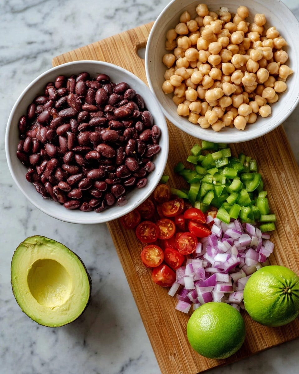 The image shows a white bowl full of dark red beans on the left side and another white bowl filled with light brown chickpeas at the bottom. In the middle is a wooden cutting board with diced purple onions, chopped green peppers, and halved red cherry tomatoes. Also on the board is a halved green avocado with a scored flesh texture. There are two whole green limes placed on a white marbled surface near the bowls and cutting board. The colors are bright and fresh, with the beans and chickpeas looking smooth and firm. Photo taken with an iphone --ar 4:5 --v 7