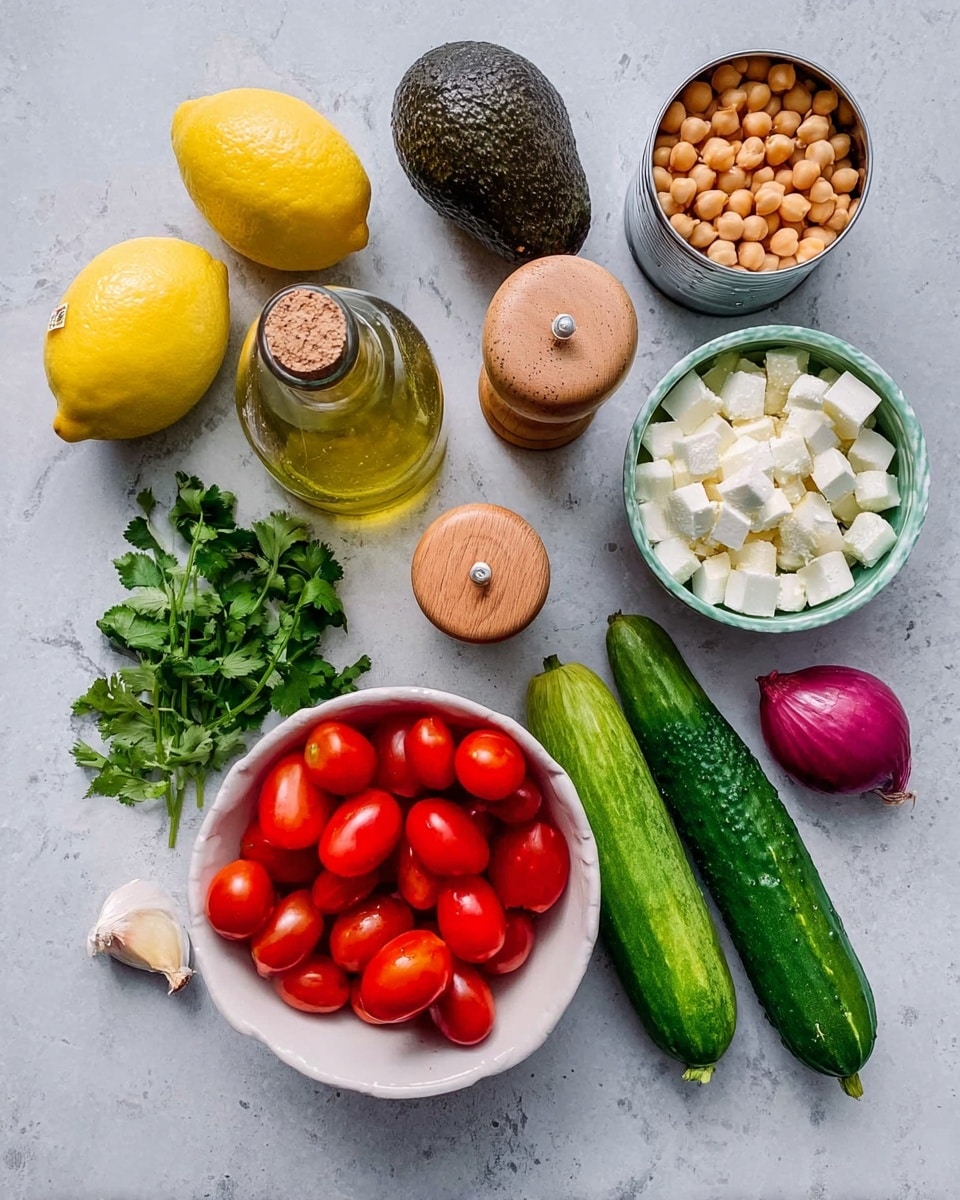 The image shows fresh ingredients arranged on a white marbled surface: a whole yellow lemon and a dark avocado at the top left, a glass bottle with cork stopper in the center, behind two wooden salt and pepper shakers; an open tin of chickpeas at the top right. Below these are a bunch of green cilantro on the left, three green cucumbers to its right, a small red onion and a single garlic clove below the cucumbers. To the right of these, a white bowl filled with bright red grape tomatoes sits above another white bowl filled with small cubes of white cheese. photo taken with an iphone --ar 4:5 --v 7
