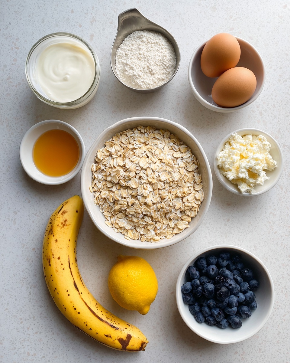 A white marbled surface holds several ingredients neatly arranged: at the center is a white bowl full of light beige rolled oats with a rough texture; to its top right, a white bowl contains two brown eggs; above the oats on the left side, a small glass jar filled with smooth white yogurt sits next to a metal measuring cup with white cottage cheese that has a lumpy texture; a small white bowl of baking powder is to the left; below the oats is a ripe yellow banana with brown spots; to the bottom left of the banana is a small white bowl filled with golden honey; to the bottom right of the oats is a bright yellow lemon; and to the far right bottom corner is a small white bowl filled with dark blue, round blueberries. photo taken with an iphone --ar 4:5 --v 7