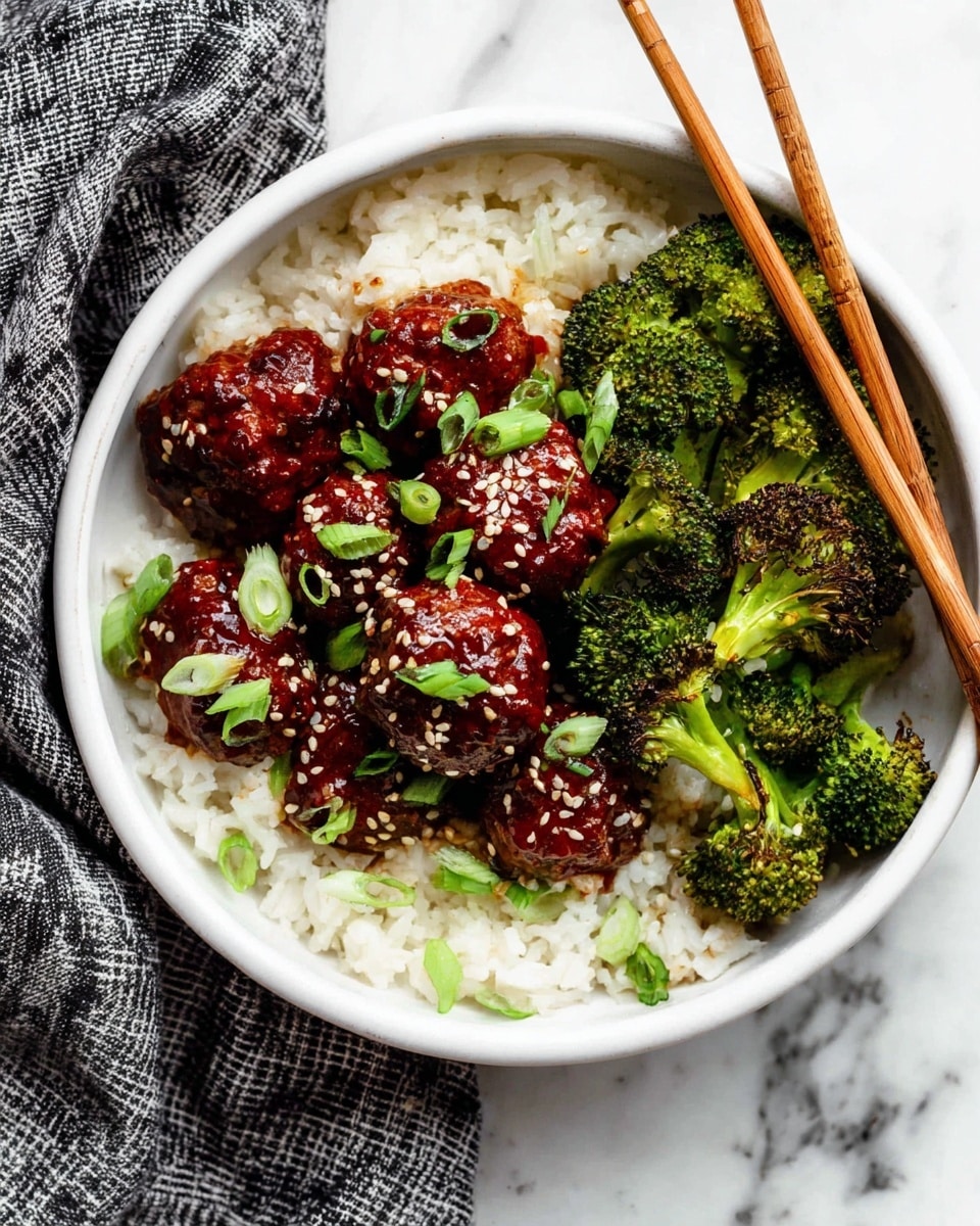 A white bowl filled with three layers: the bottom layer is plain white rice with a soft texture, the middle layer consists of dark red glazed meatballs sprinkled with white sesame seeds and topped with thinly sliced green onions, and the top layer has bright green roasted broccoli pieces with slightly charred edges placed on one side, with wooden chopsticks resting on the rice near the meatballs. The bowl sits on a white marbled surface with a gray and black checkered cloth partially visible on the side. Photo taken with an iphone --ar 4:5 --v 7