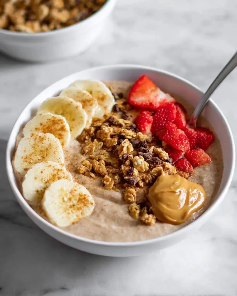 Chocolate Protein Yogurt Bowl with Peanut Butter and Toppings Recipe