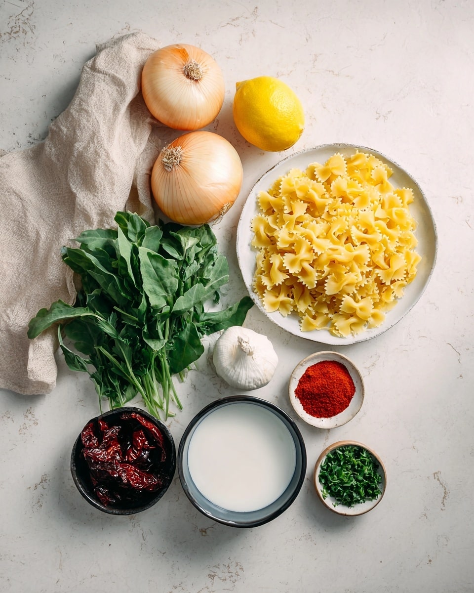 The image shows several cooking ingredients arranged on a white marbled surface. There is a cluster of five pale yellow onions near a soft beige cloth on the left side. Below them is a bright yellow lemon. To the right, a white bowl filled with uncooked yellow farfalle pasta is placed. Above the pasta bowl, a white plate holds fresh green leafy herbs with different shades of green and varying leaf shapes. Below the pasta bowl, a small white bowl contains white liquid, likely milk or cream. Next to it is a small bowl with bright red powdered spice, and a smaller bowl with chopped green herbs. At the bottom left, there is a whole garlic bulb and a small dark bowl filled with dark red sun-dried tomatoes. The photo is taken with an iphone --ar 4:5 --v 7
