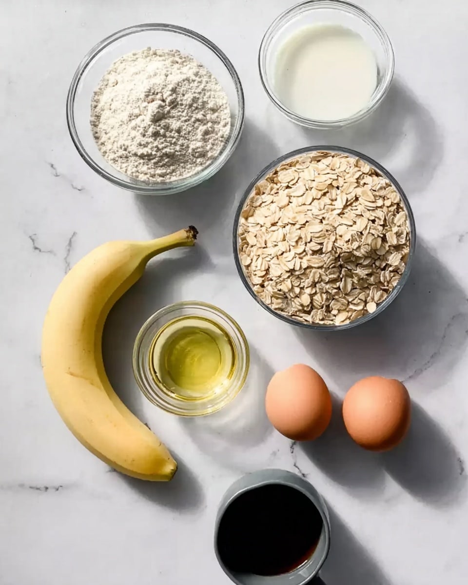 A white marbled surface holds six ingredients arranged loosely in a circle: a whole light yellow banana on the left, a small clear glass bowl holding white powder at the top center, a larger clear bowl filled with a white liquid behind it, a gray measuring cup filled with rolled oats on the right, a small glass bowl with clear light yellow oil below the oats, two brown eggs close together on the right bottom, and a dark gray measuring cup filled with a dark brown liquid near the eggs. The light and shadows show a soft natural light from the upper left direction. photo taken with an iphone --ar 4:5 --v 7