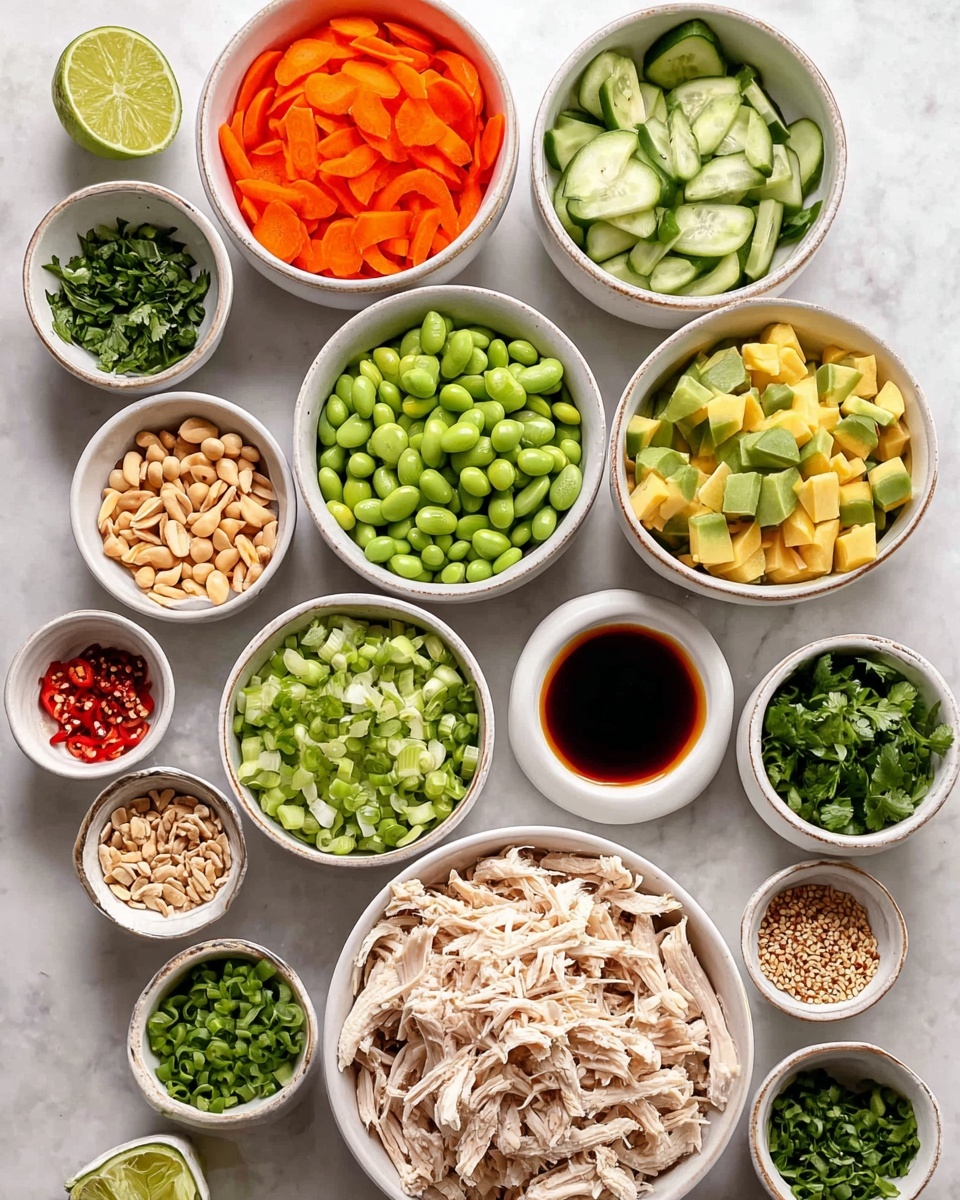 This image shows many small white bowls arranged on a white marbled surface, each holding different colorful ingredients for a meal. At the center bottom is a bowl filled with shredded light beige chicken. Above it, there is a bowl of bright orange carrot slices, and to the right of the chicken, a bowl of sliced green cucumbers. At the top right, a bowl holds green edamame beans, while next to it is a small bowl of diced yellow avocado. Above the chicken and carrot bowls, another bowl contains chopped orange bell peppers. On the left side, there are lime halves on a small white dish, a bowl of chopped green parsley, and a small dish of red chili flakes. In addition, bowls hold diced green onions, chopped green chili peppers, crushed peanuts, minced garlic, black and white sesame seeds, and several small bowls with different colored sauces. The photo taken with an iphone --ar 4:5 --v 7