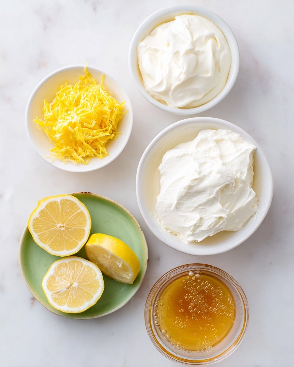 The image shows five separate items arranged on a white marbled surface: at the top right is a white bowl filled with thick, creamy white cheese with a soft texture; below it to the right is another white bowl with a slightly smoother-looking white cream; to the left of these bowls is a small white bowl with yellow shredded citrus peel; below this is a transparent small bowl filled with golden honey that has tiny bubbles inside; and at the bottom left are two lemon halves on different green plates, both showing their juicy, pale yellow flesh. photo taken with an iphone --ar 4:5 --v 7