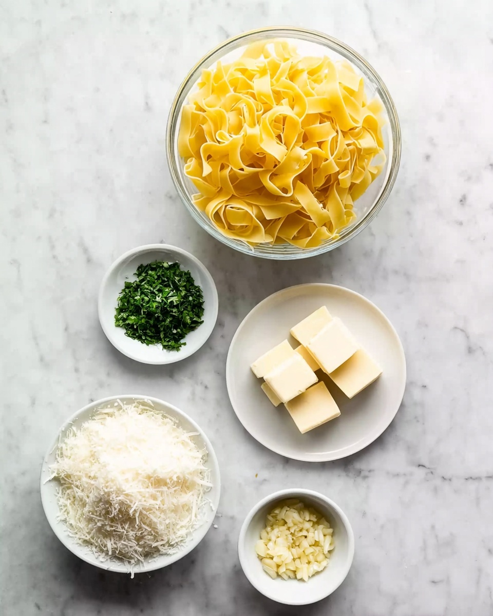 A clear glass bowl filled with flat wide yellow pasta sits at the top left on a white marbled surface. Below it to the right, a small white plate shows five square pieces of pale yellow butter. Centered below the pasta bowl is a small white bowl filled with finely chopped green herbs. To the bottom left, a larger white bowl holds a heap of grated white cheese. Finally, at the bottom right, a small white bowl contains minced or grated pale yellow garlic. photo taken with an iphone --ar 4:5