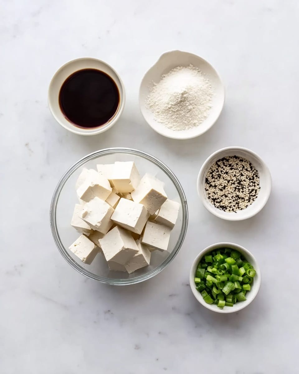 The image shows five small white bowls arranged neatly on a white marbled surface. In the center bottom, there is a clear glass bowl filled with white tofu cubes stacked evenly. To the left of the tofu bowl is a small white bowl filled with a dark brown sauce. Above that is another small white bowl filled with white powder, likely a seasoning. To the right of the powder is a small white bowl containing black and white sesame seeds. On the far right is a small white bowl filled with chopped green onions. The overall scene is clean and bright with a soft, natural light. Photo taken with an iphone --ar 4:5 --v 7
