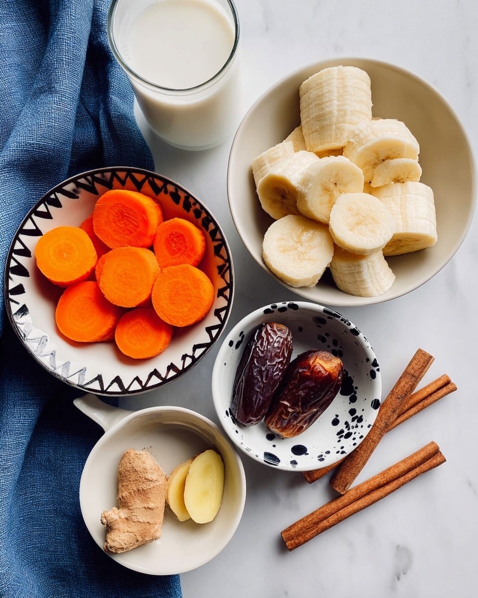 The image shows five bowls on a white marbled surface with different ingredients arranged neatly. The center bowl is white and filled with seven thick slices of peeled banana, showing a creamy yellow color and soft texture. Below it, to the left, there is a white bowl with a bold black zigzag pattern around the rim, holding round, bright orange carrot slices stacked closely together. To the right of the banana bowl, there is a small white bowl with black paint splatter designs, containing a piece of brown ginger root and a small ginger slice with a smooth yellow inside. Next to it is a simple white bowl with one shiny, dark brown date inside, showing its wrinkled texture. At the top right, a plain white bowl contains two cinnamon sticks with a deep reddish-brown color, a long slender black vanilla pod, and a white spoon filled with light brown cinnamon powder resting inside it. On the top left corner of the image, part of a glass filled with white milk and a blue cloth are visible. Photo taken with an iphone --ar 4:5 --v 7