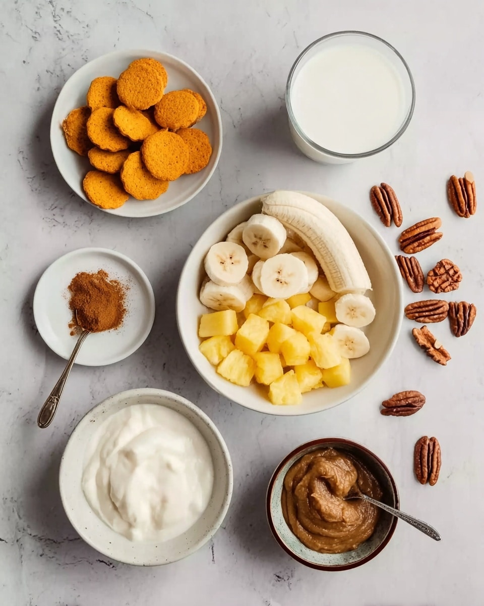 The image shows several white bowls and a clear glass on a white marbled surface. One white bowl in the center is filled with peeled, halved bananas. Below it, another white bowl contains chopped yellow pineapple pieces. To the left, a white bowl is filled with small orange round cookies or biscuits. Next to it, a small white plate holds brown powder, likely cinnamon. Below that, a white bowl contains a thick, creamy white substance. To the right of the bananas, a small brown bowl has a thick brown paste with a spoon inside. A clear glass filled with a white liquid, possibly milk, is also present near the top right. Some pecans are scattered around the bowls. Photo taken with an iphone --ar 4:5 --v 7