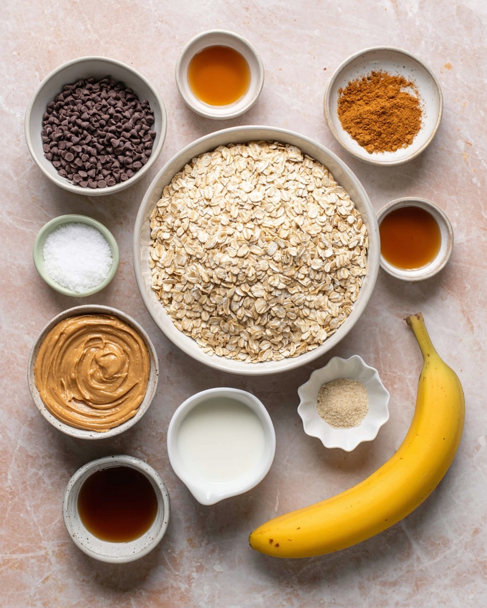 The image shows a top-down view of ingredients arranged neatly on a white marbled surface. In a large white bowl in the center, there is a full layer of light beige rolled oats. Surrounding this bowl in a loose circle are smaller white bowls and containers holding other ingredients: a white bowl filled with dark brown chocolate chips, a white bowl with creamy light brown peanut butter with a smooth, swirled texture, a white bowl with a fine white powder (likely baking powder), a white bowl with white salt, a small white creamer with white milk, a small cup with dark amber liquid (maple syrup), a small white bowl holding a dark brown liquid (vanilla extract), and a single yellow banana with a few small brown spots. Above the oats is a light brown egg and a small white flower-shaped dish with orange-brown cinnamon powder. The arrangement is clean and organized, giving a clear view of each item used for the recipe, photo taken with an iphone --ar 4:5 --v 7