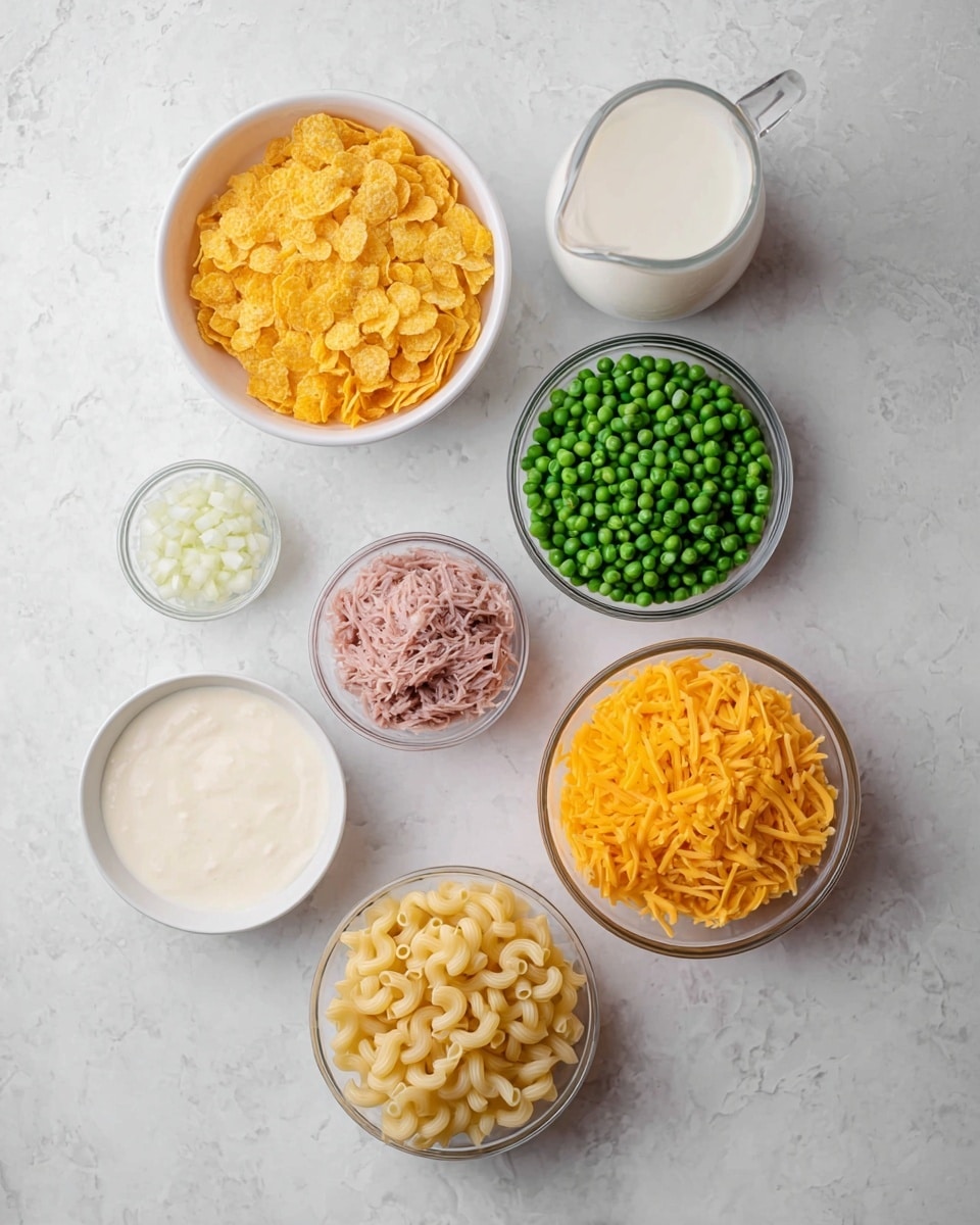 Seven white bowls with different food ingredients are placed on a white marbled surface. From the top left, there is a bowl filled with yellow corn flakes, next to it is a clear glass pitcher with white milk, below the corn flakes is a white bowl with frozen green peas, and to the right of the peas is a glass bowl containing shredded pink tuna. Below the peas is a bowl filled with bright orange shredded cheddar cheese, next to it on the right is a white bowl with cooked elbow macaroni pasta that is yellowish in color. At the bottom left, there is a white bowl with creamy white sauce, and a small glass bowl with finely chopped white onions is placed between the peas and the sauce. The setting is simple and clean. photo taken with an iphone --ar 4:5 --v 7