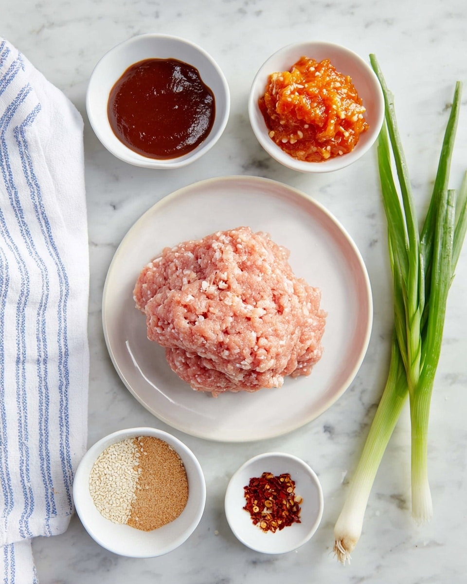 A close-up shot of raw ground chicken placed in a mound on a white plate in the center, surrounded by five small white bowls arranged around it. From top left clockwise, the first bowl holds a thick dark brown sauce, the second bowl has a chunky, bright orange sauce with visible bits, the third bowl contains small white sesame seeds, the fourth small bowl contains light brown ground powder, and the fifth small bowl holds red chili flakes. To the right of the bowls, there are three fresh green onions with long white and green stalks. The entire scene is set on a white marbled surface with a white cloth featuring blue stripes partially visible on the left side. Photo taken with an iphone --ar 4:5 --v 7