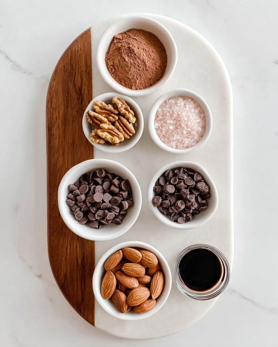 The image shows a white marbled oval board with a curved wooden inlay on the left side, holding six small white bowls arranged in a loose cluster. From top left moving clockwise, the first bowl is filled with light brown cocoa powder, the next contains brown walnut halves, followed by dark brown small chocolate chips in the third bowl, a small bowl of light pink salt, and below that a tiny bowl with a dark liquid inside, possibly vanilla extract. The bottom left bowl has raw brown almonds. The white marbled background contrasts softly with the natural colors and different textures of the ingredients. photo taken with an iphone --ar 4:5 --v 7