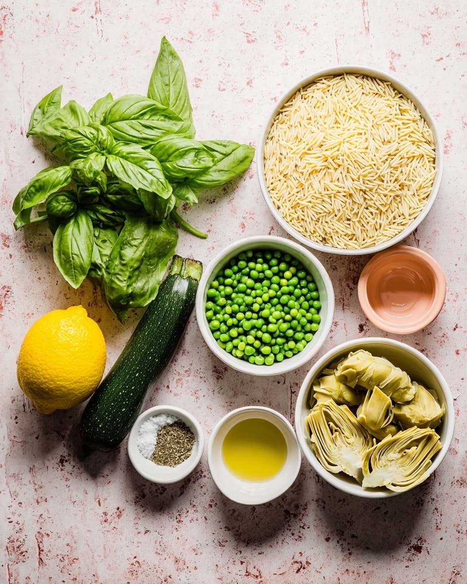 A display of fresh cooking ingredients on a white marbled textured background includes a bunch of bright green basil leaves on the left next to a whole yellow lemon and a dark green zucchini. To the right, several white bowls hold various items: the largest bowl is filled with pale yellow uncooked orzo pasta, a medium bowl contains fresh vibrant green peas, and another medium bowl holds light yellow artichoke hearts with some herbs. There are two smaller white bowls, one with coarse salt mixed with dried green herbs, and the other with a small amount of olive oil. A small empty peach-colored bowl sits near the center. The photo taken with an iphone --ar 4:5 --v 7