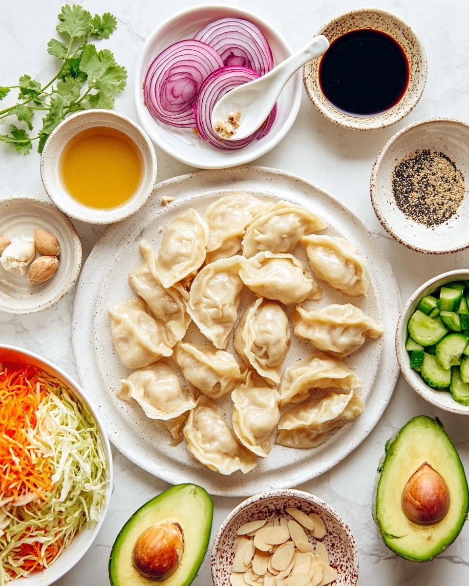 A white speckled round plate is full of light beige dumplings with crimped edges, placed in a loose pile in the center. Surrounding this main plate are several small white speckled bowls filled with various sauces and ingredients: a clear golden sauce, dark soy sauce, and a light beige liquid with pepper flecks. To the left, a small white plate holds thinly sliced red onions arranged in a rose shape, accompanied by fresh green cilantro leaves and a small piece of ginger and garlic on another white plate. A bowl near the bottom left is full of shredded cabbage and carrots mixed together. At the bottom are two halves of a ripe green avocado with the pit still in one half. To the bottom right, a small patterned bowl holds light brown almond slices, and next to it is a white bowl filled with chopped green cucumbers. A white spoon with ground pepper rests near the top center, all set against a white marbled surface photo taken with an iphone --ar 4:5 --v 7