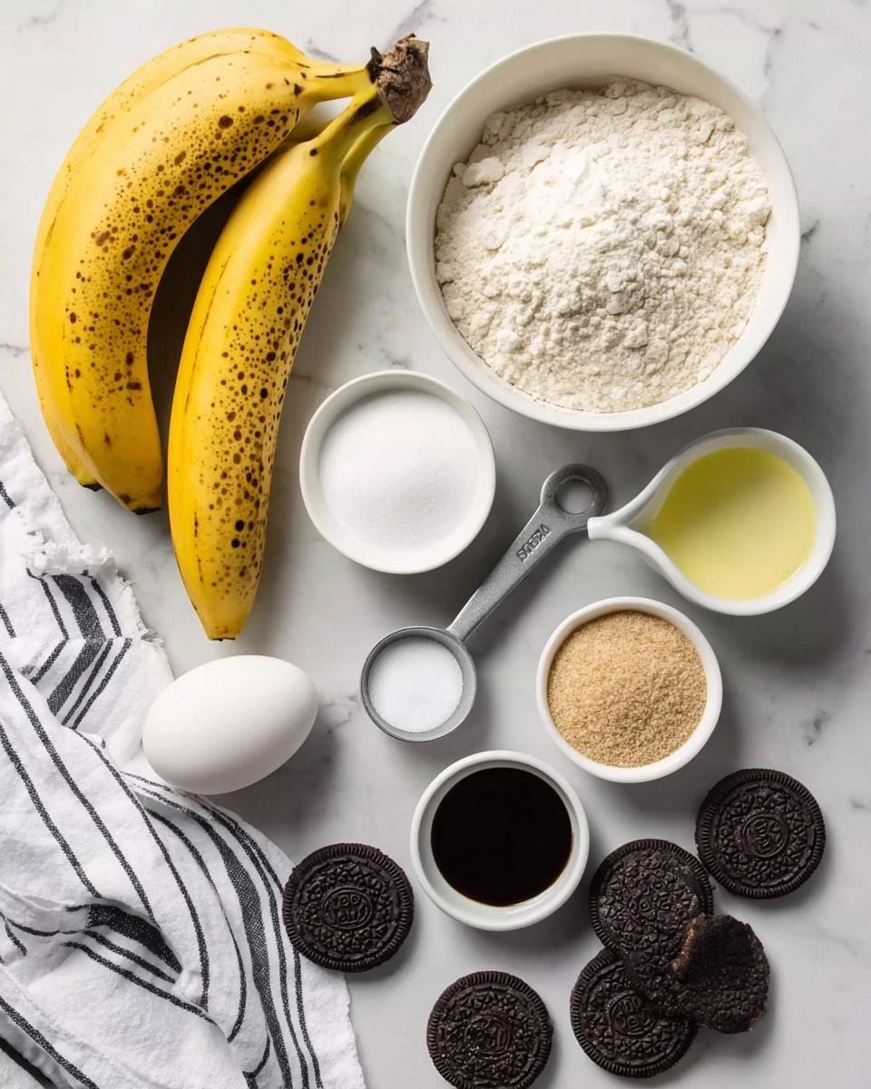 The image shows various baking ingredients carefully placed on a white marbled surface. At the top left, there is a bunch of yellow bananas with brown spots. On the top right, a white bowl filled with white flour sits prominently. Below it, a white cup holds white sugar, next to a small white bowl with light brown sugar. To the right, a small white measuring cup contains a pale yellow liquid, likely oil. Near the center, a grey metal scoop rests beside two white eggs. There is also a small white bowl with a pinch of salt, and a small white cup holds black liquid, likely vanilla extract. At the bottom, several round black cookie pieces with white centers are spread casually. A white cloth with black stripes is partially visible on the left side. Photo taken with an iphone --ar 4:5 --v 7