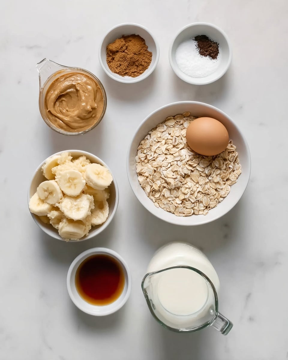 The image shows seven white bowls and a glass jug arranged on a white marbled surface. In the center, there is a white bowl filled with light beige rolled oats and a brown egg resting on top. To the top left of the bowl is a measuring cup filled with smooth, light brown peanut butter. Above the bowl is a small white bowl divided into two parts: one containing brown cinnamon powder and the other white granulated sugar. To the top right, there is a small white bowl holding dark, finely ground coffee. Below and to the left of the oatmeal bowl is another white bowl that holds mashed bananas with a creamy texture and pale yellow color. Just below the banana bowl, a smaller white bowl contains dark amber vanilla extract. To the far right, a clear glass jug is filled with white milk. The setup is tidy and well-lit, with a clean, soft shadow effect. photo taken with an iphone --ar 4:5 --v 7
