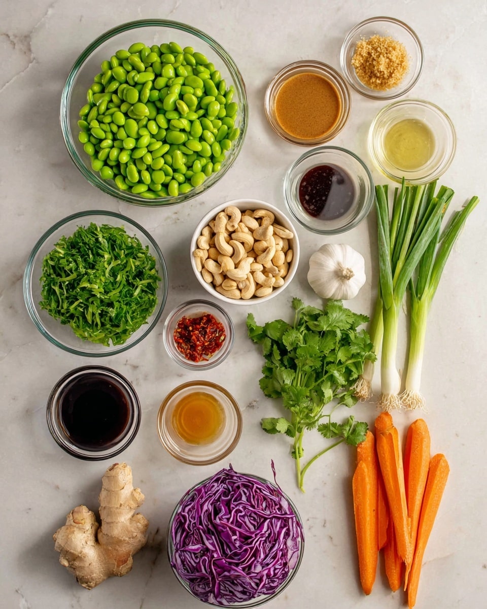 The image shows a top view of ingredients laid out on a white marbled surface. There are twelve glass bowls and loose vegetables arranged neatly. In the center, a large bowl is filled with green edamame beans with a fresh, smooth texture. Below this, a bowl of chopped green leafy vegetables sits to the left and another bowl to the right contains thinly sliced purple cabbage, both with crisp textures. To the right center, a white bowl holds a pile of light brown cashew nuts. Above it, is a bunch of fresh green cilantro with delicate leaves, and two bright orange carrots lay next to a few green onions with white bulbs at the end, all fresh and whole. Near the top center is a whole bulb of garlic and a piece of beige ginger root with a rough surface. On the left side, six small glass bowls hold various sauces and liquids, including a tan peanut sauce, dark soy sauce, a small heap of red chili paste, and three other liquids in shades of light amber to clear. The overall presentation is clean and organized, with natural colors and fresh textures visible. photo taken with an iphone --ar 4:5 --v 7