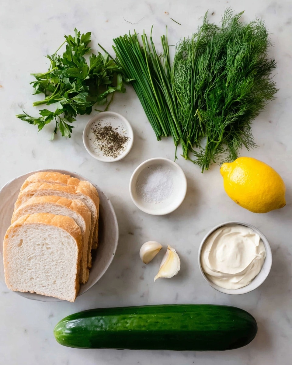 The image shows several fresh ingredients neatly arranged on a white marbled surface. On the left, four slices of white bread are stacked in a white bowl. Next to the bowl, there are three bunches of green herbs: flat parsley, long chives, and feathery dill. Above the herbs is a small white bowl of salt and pepper. To the right, there is a whole yellow lemon and a single clove of garlic. Two small white bowls are placed beside the lemon, one holding a smooth off-white creamy sauce and the other with thick white cream. At the bottom, a long, dark green cucumber lies horizontally across the surface. The photo taken with an iphone --ar 4:5 --v 7