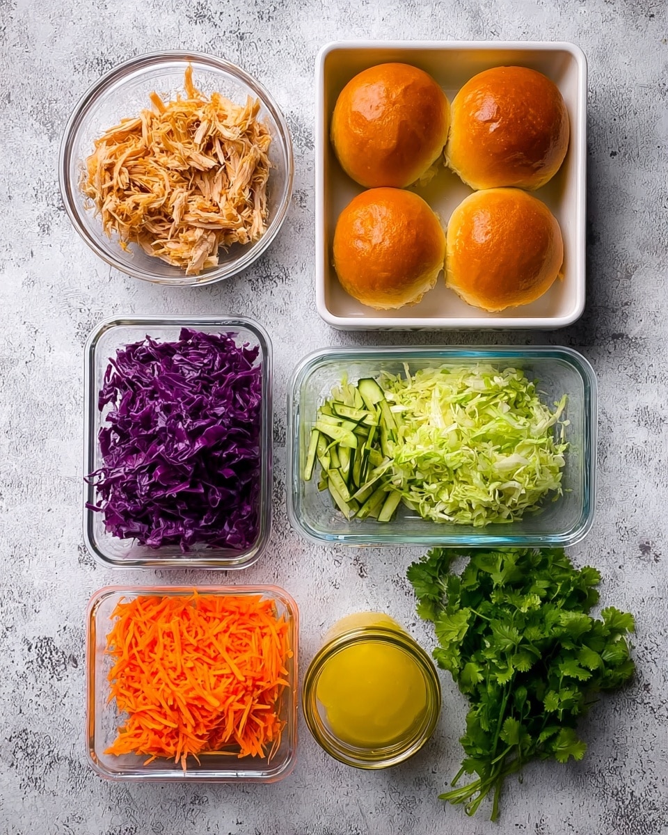 The image shows raw ingredients arranged neatly on a white marbled surface. At the top center, there is a white square box containing four shiny, golden brown bread rolls. To the left is a clear glass bowl filled with shredded cooked chicken. Below that is a smaller clear rectangular glass container with shredded pale green cabbage mixed with thin strips of cucumber. To the right of that is a clear rectangular glass container with shredded bright orange carrots. At the bottom left is a larger rectangular glass container filled with vibrant purple shredded cabbage. A small glass jar with yellow dressing sits to the right of the large container, and a fresh bunch of bright green cilantro lies beside the jar on the right. photo taken with an iphone --ar 4:5 --v 7